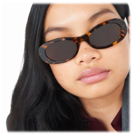 tortoise shell sunglasses miu miu|MIU MIU Glimpse oval.